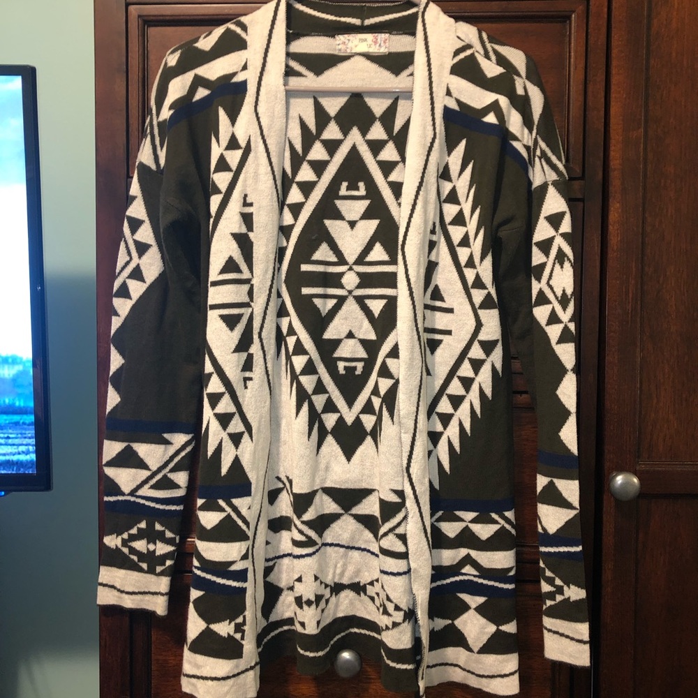 Dark green, cream, and blue cardigan.